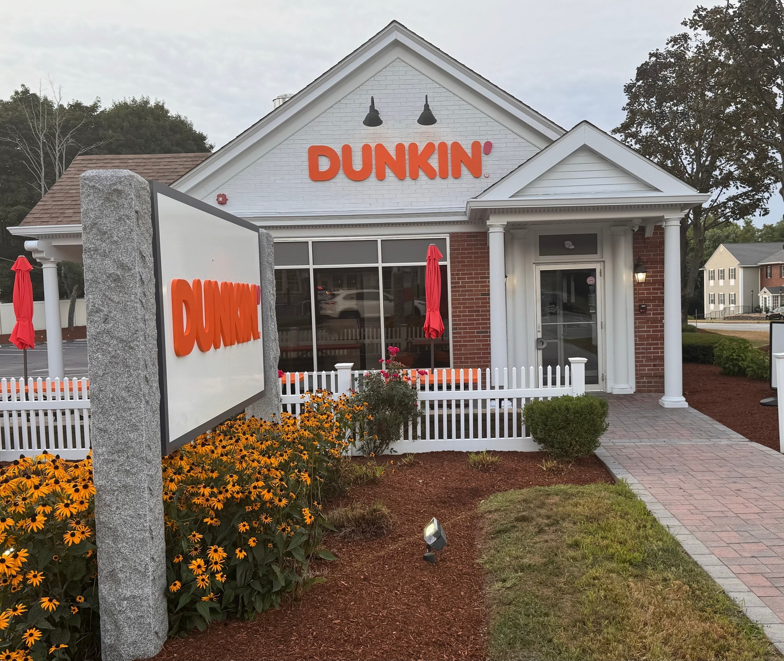 TCD Management Dunkin' storefront with garden